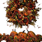 Autumn-themed wreath with pumpkins on black background