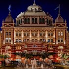 Palatial Building with Domes Overlooking Market Scene at Dusk