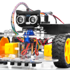 Colorful Educational Robot with Camera Head and Large Wheels on White Background