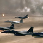 Military aircraft formation over desert with smoke and explosions