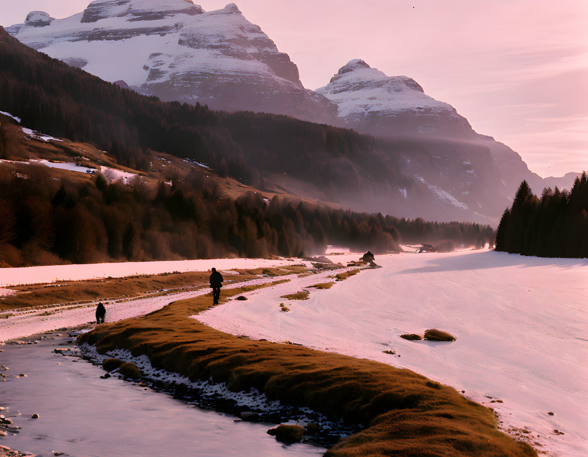 Snowy landscape: Two people walking by stream at sunset