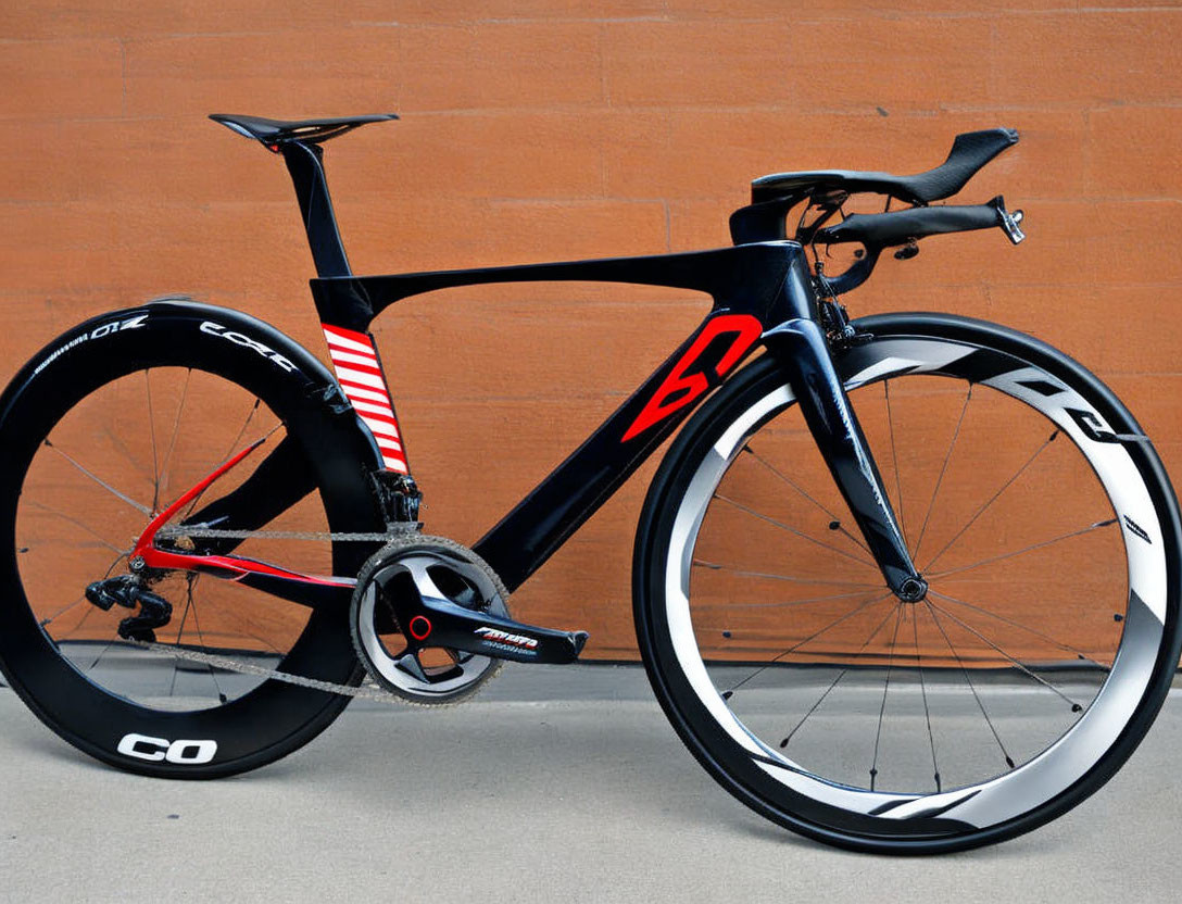 Black and Red Time Trial Bicycle with Aerodynamic Frame and Disc Rear Wheel