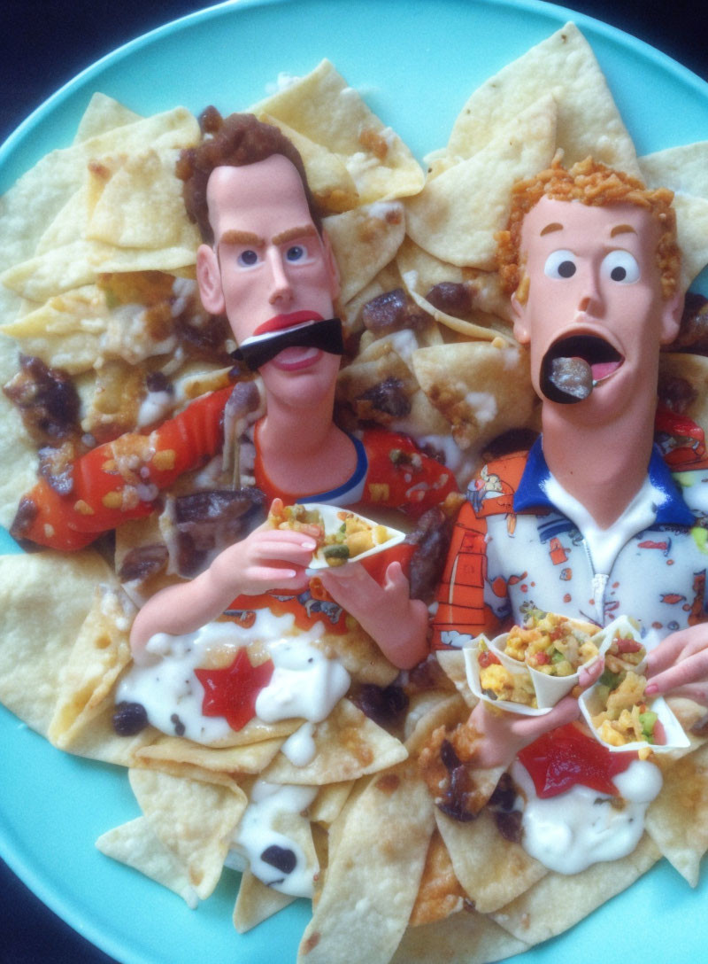 Claymation-style male figures with exaggerated features on nachos plate