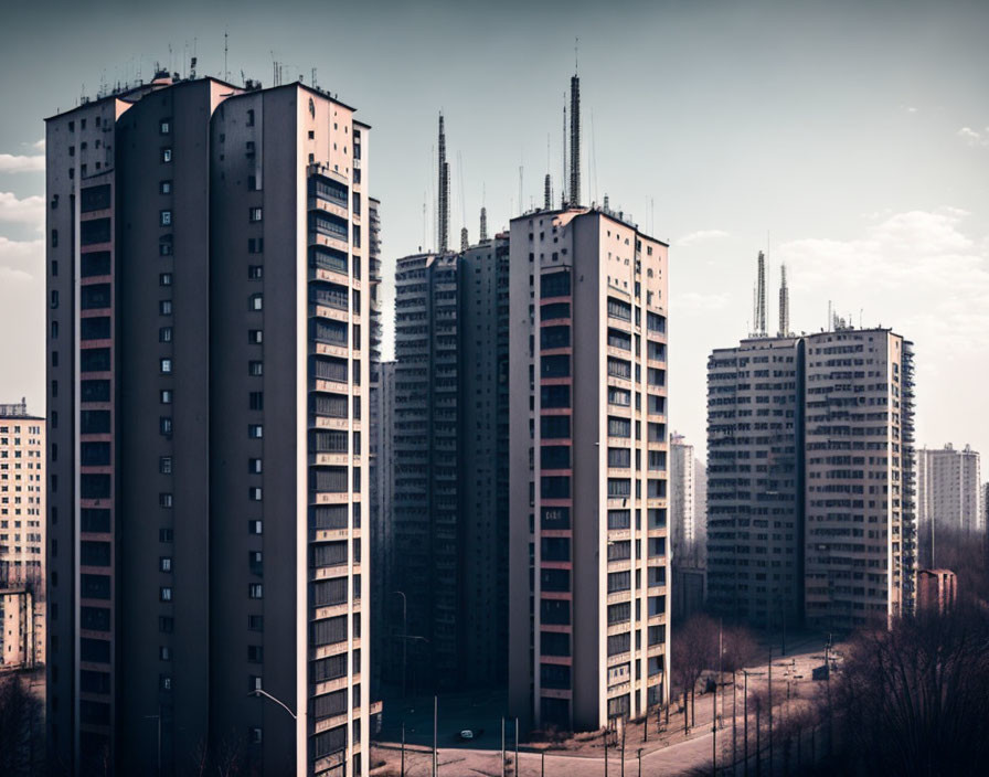 Urban skyline featuring tall residential buildings under clear sky