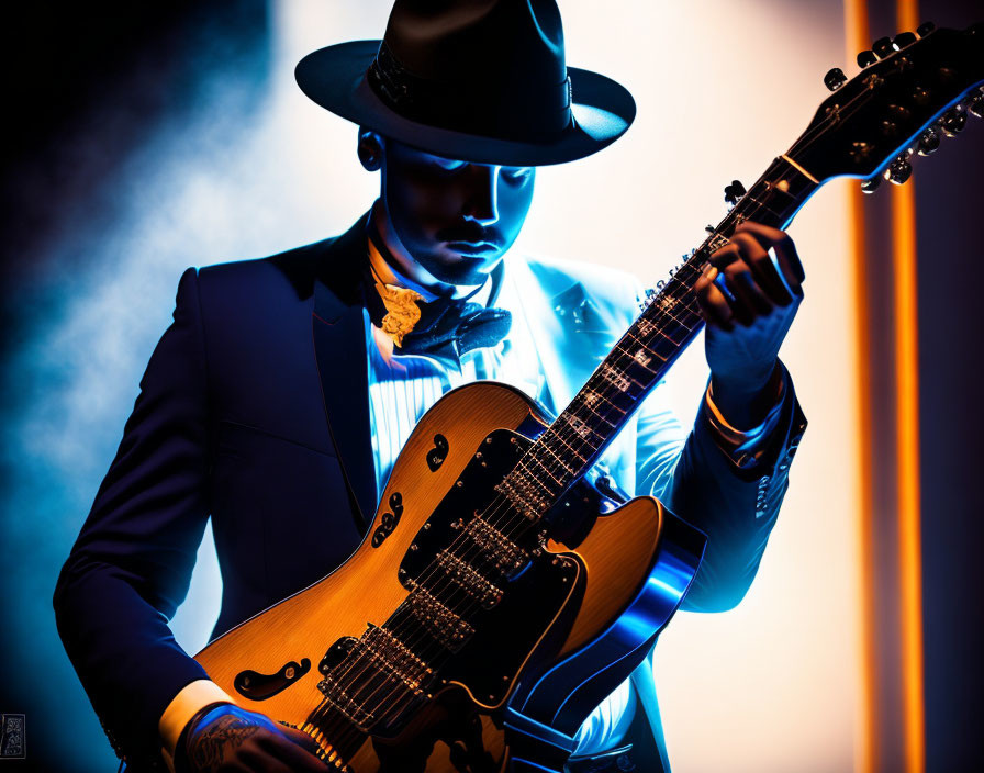 Stylish guitarist in hat plays electric guitar under blue and orange lights