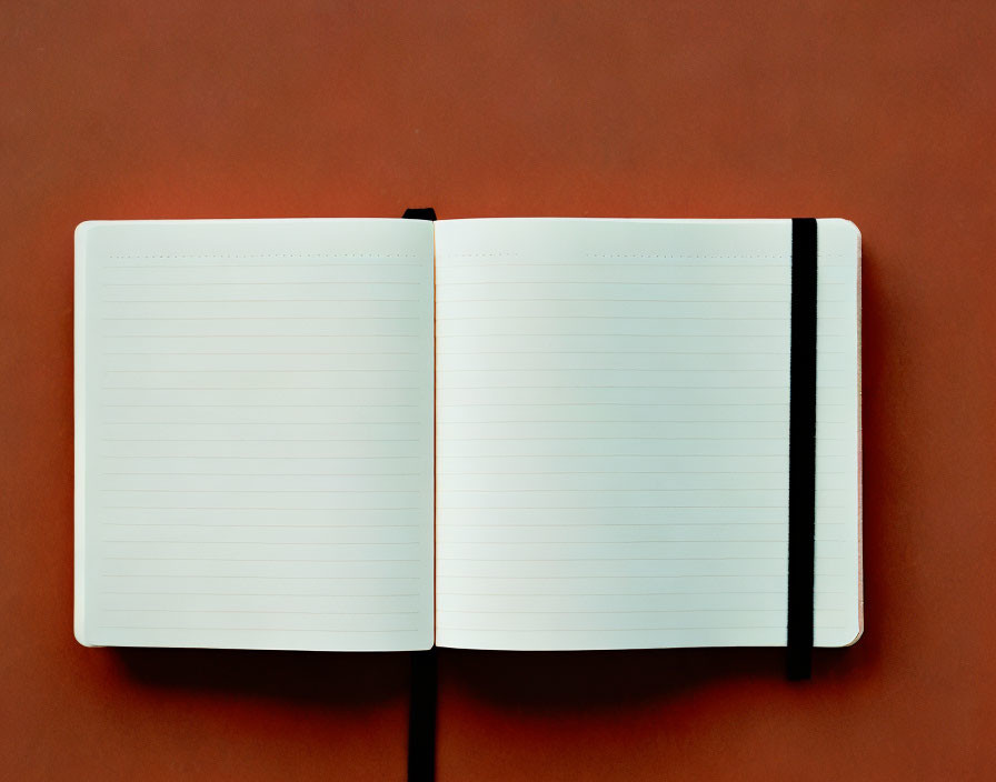 Blank notebook with black bookmark on brown background