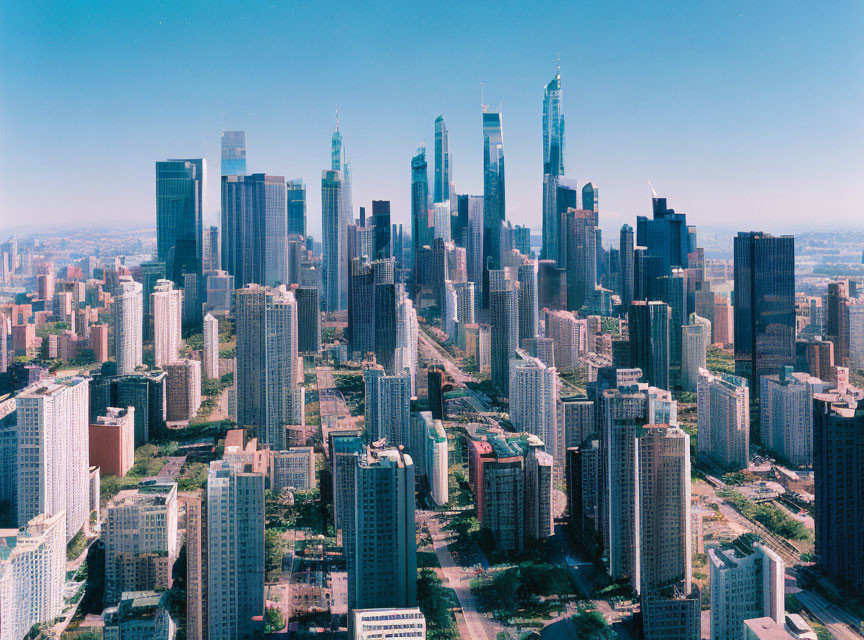 Urban skyline of clustered skyscrapers under clear blue sky