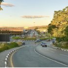 Futuristic cityscape with greenery, advanced infrastructure, clean roads, eco-friendly vehicles