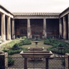 Ancient Roman House Courtyard with Columns, Garden, and Pool