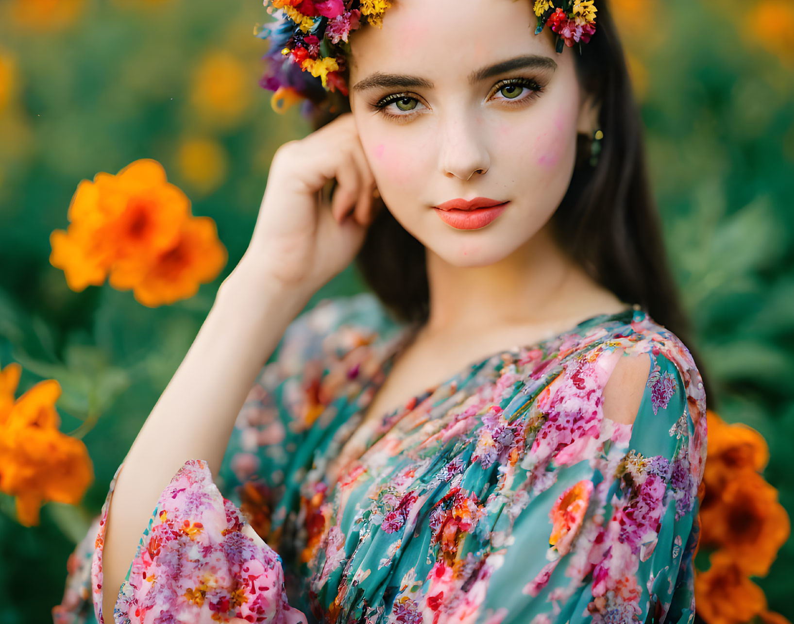 Woman in floral crown and colorful dress in marigold field pose.