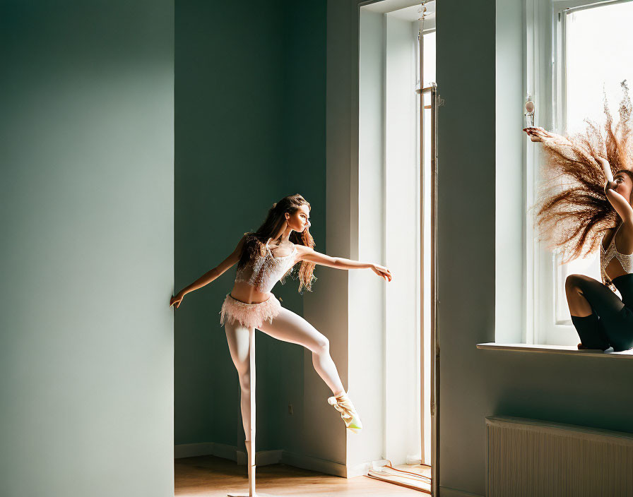 Ballet dancer in pointe shoes and tutu poses by window in natural light