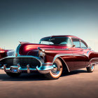 Vintage Red Car with Chrome Details in Desert Landscape