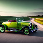 Vintage green car with red seats driving on winding road through green hills under clear sky