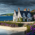 White Coastal House with Red Roofs Surrounded by Purple Flowers and Beach View