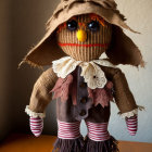 Handmade burlap doll with button eyes and stitched smile on neutral background