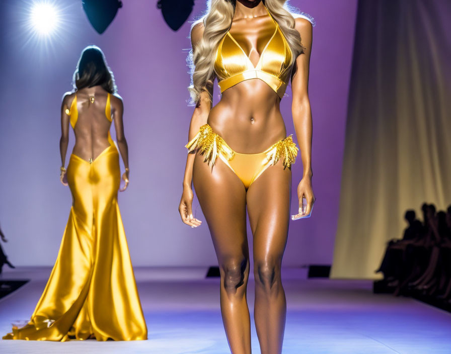 Fashion show: Gold bikini and evening gown models on runway spotlighted with purple lighting