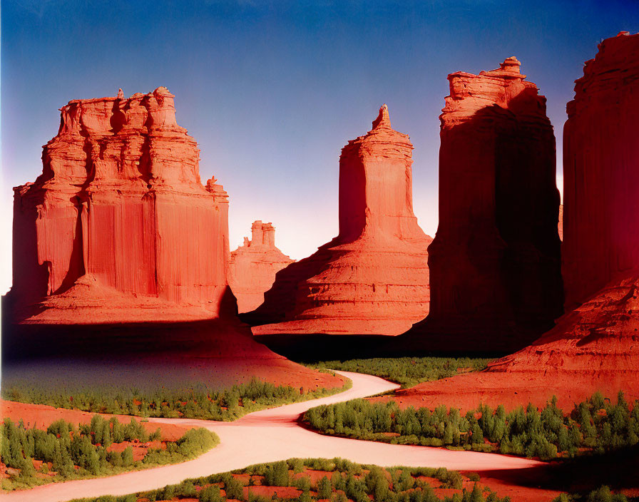 Scenic valley with winding river and red sandstone buttes