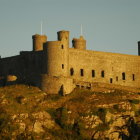 Medieval castle on hill, autumn trees, clear sky