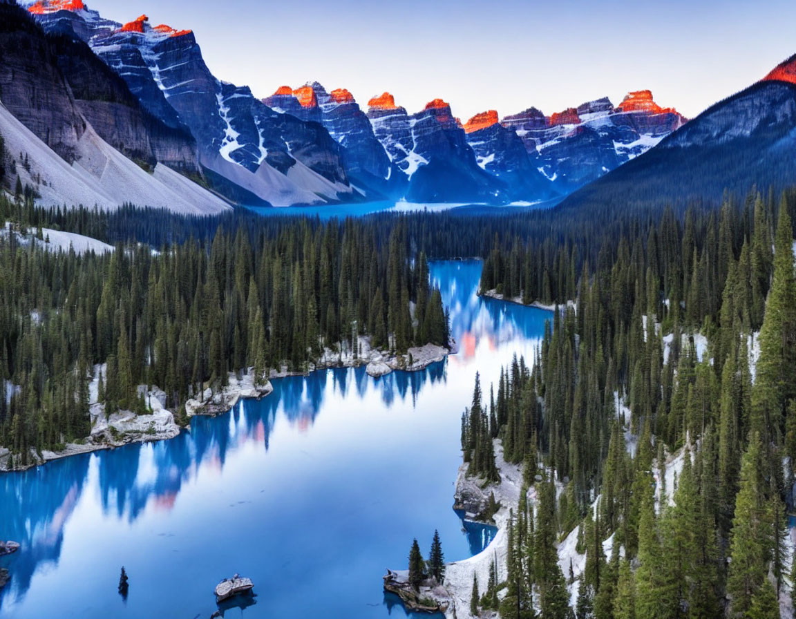 Scenic Sunrise Over Alpine Lake and Mountain Peaks