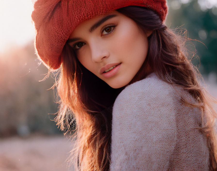 Young Woman in Red Beret and Long Hair in Soft Golden Sunlight