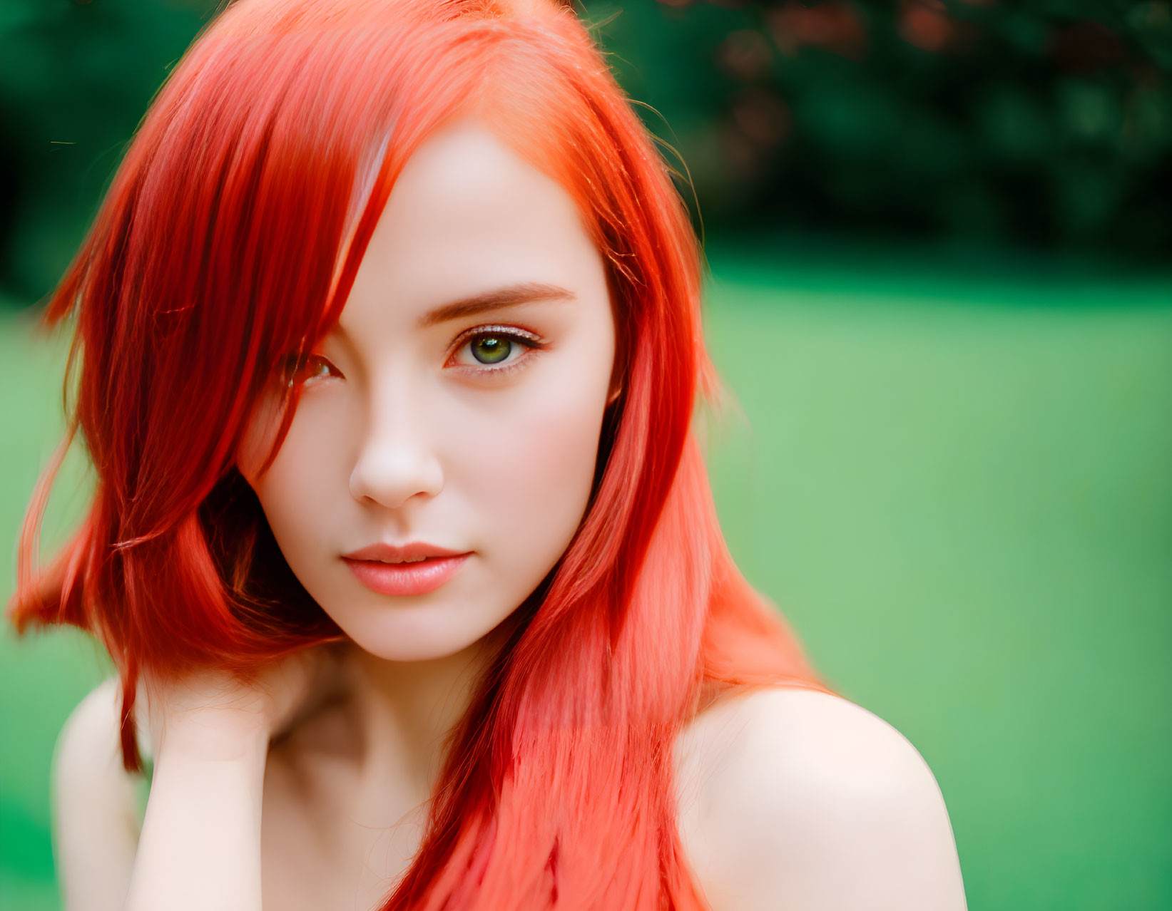 Striking Red-Haired Woman with Green Eyes on Blurred Background