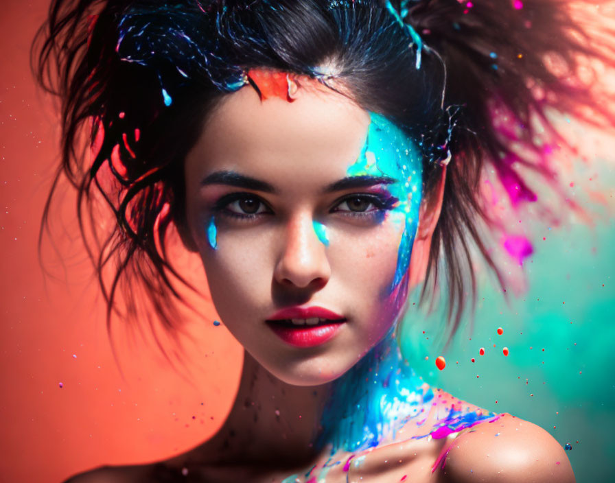 Woman with Neon Paint Splashes on Face and Hair in Warm Background