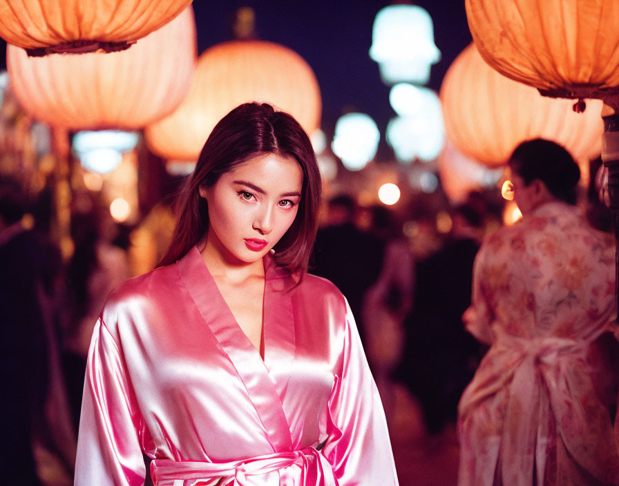 Woman in Pink Silk Kimono at Night Festival with Red Lanterns