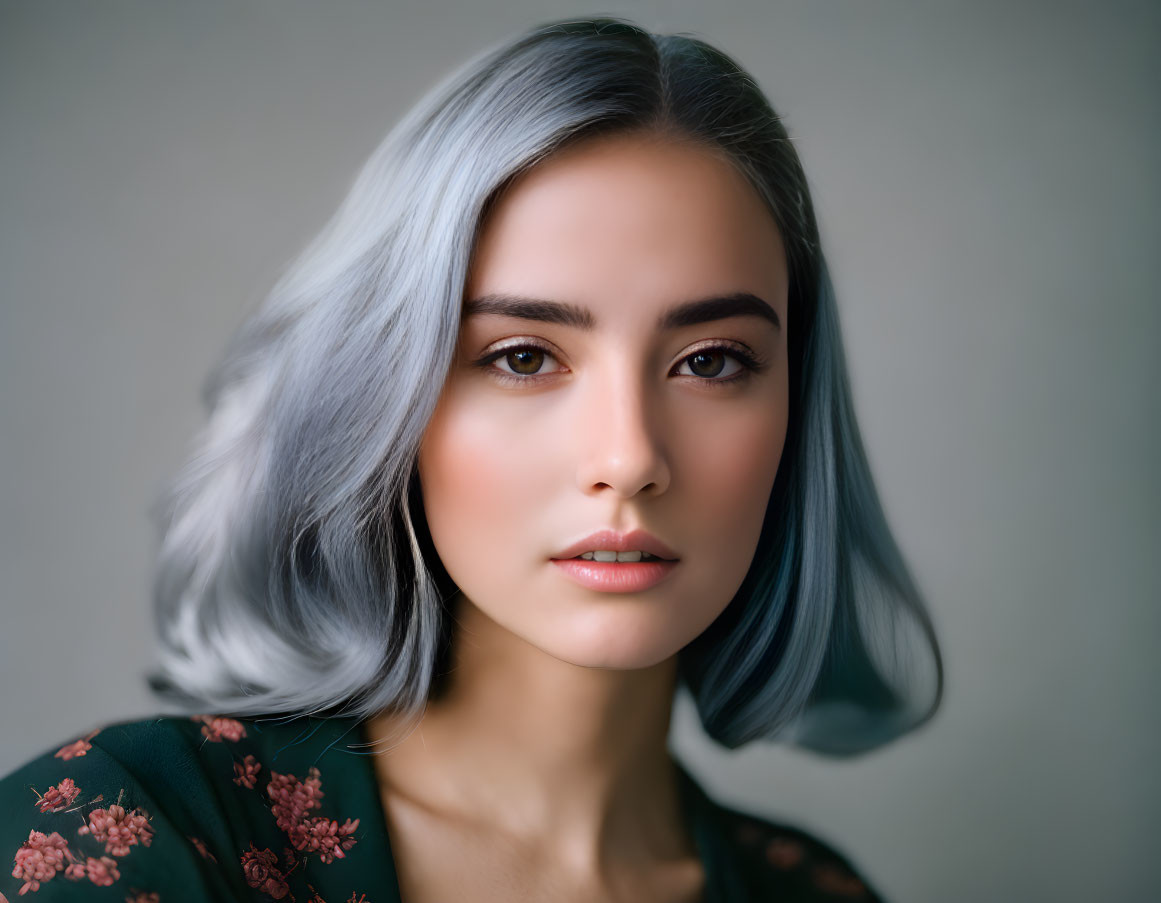 Silver-Haired Woman in Green Floral Outfit on Gray Background