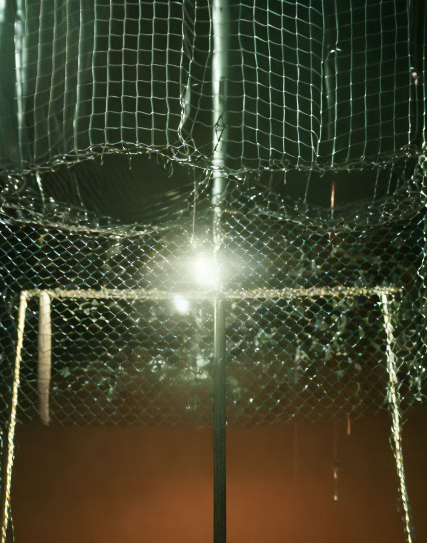 Dimly Lit Soccer Goal Net with Starburst Effect