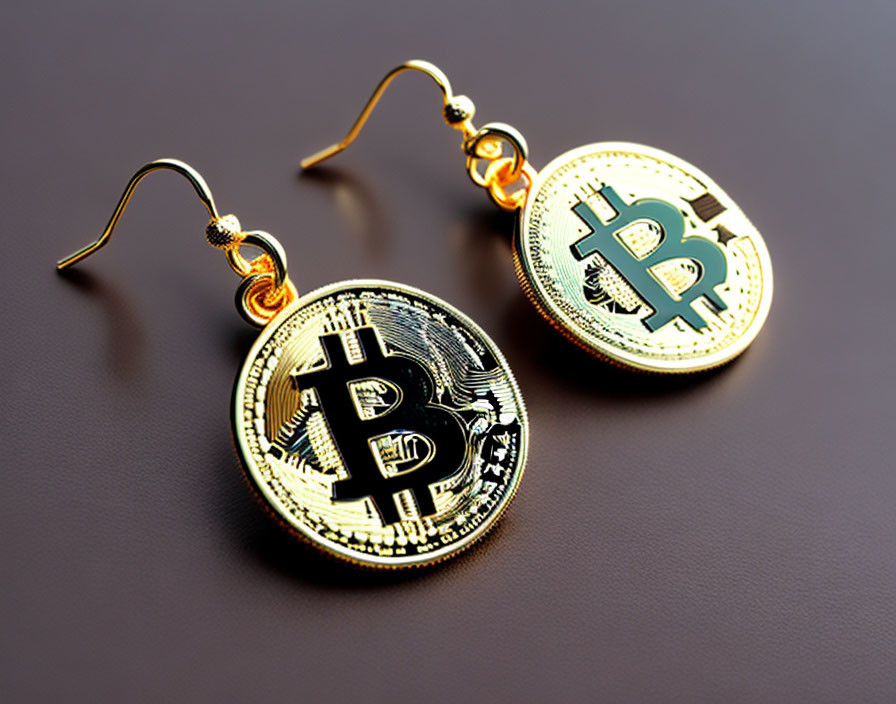 Golden Bitcoin Token Earrings on Dark Background