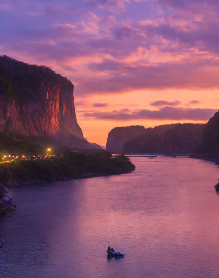 Tranquil Twilight Scene: Purple and Orange Sky, River, Boat, Cliff, Dim Lights