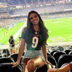 Female Character with Trophy in Stadium Setting