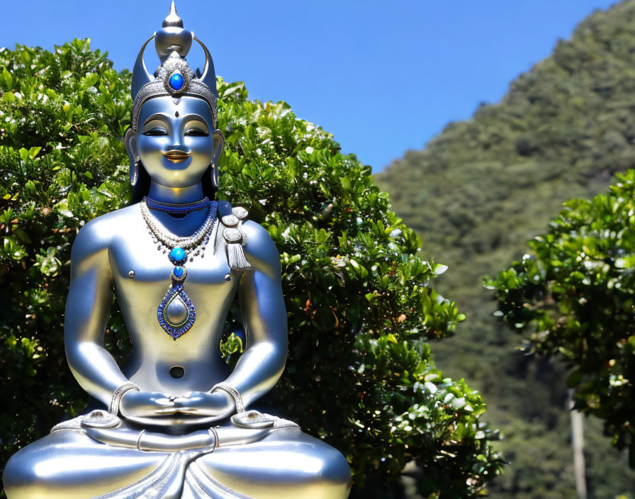 Metallic Buddha Statue with Jewels Meditating Outdoors