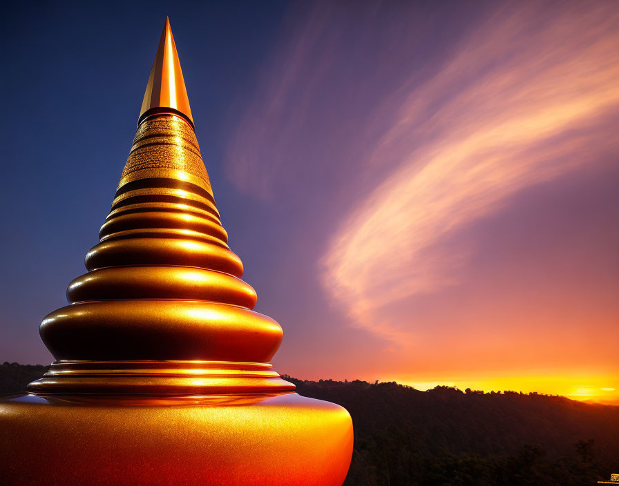 Golden Pagoda Spire Silhouetted Against Vibrant Sunset Sky