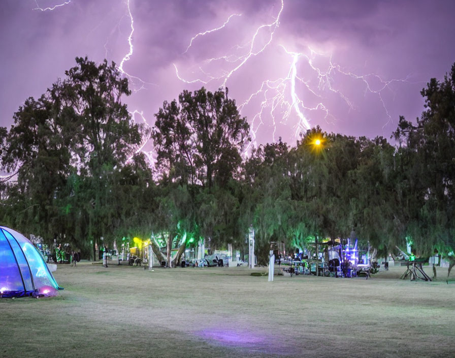 Colorful Night Park Scene with Lightning Strikes in Stormy Sky