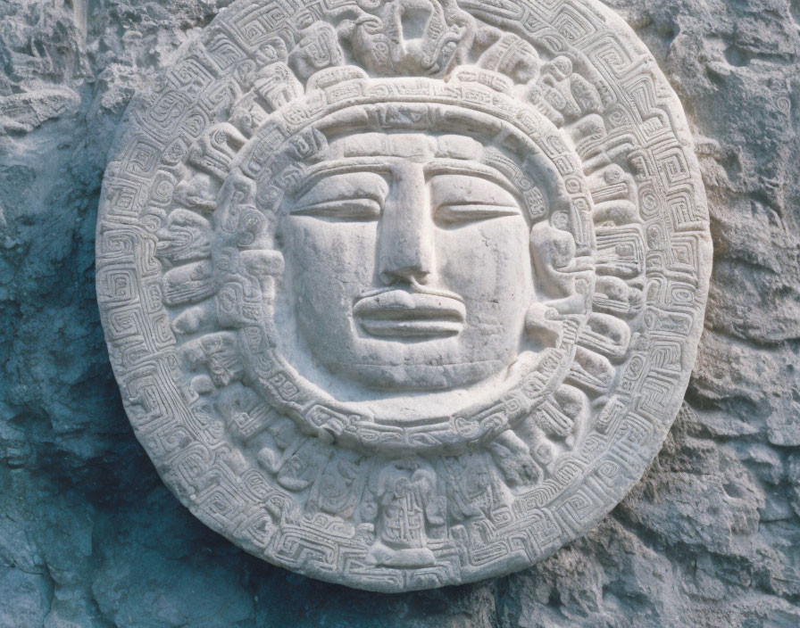 Intricate Stone Aztec Sun Disc on Textured Grey Background