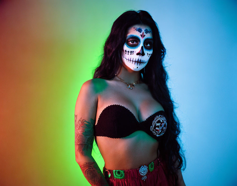 Skull Makeup Woman in Black Bra and Red Skirt on Colorful Background