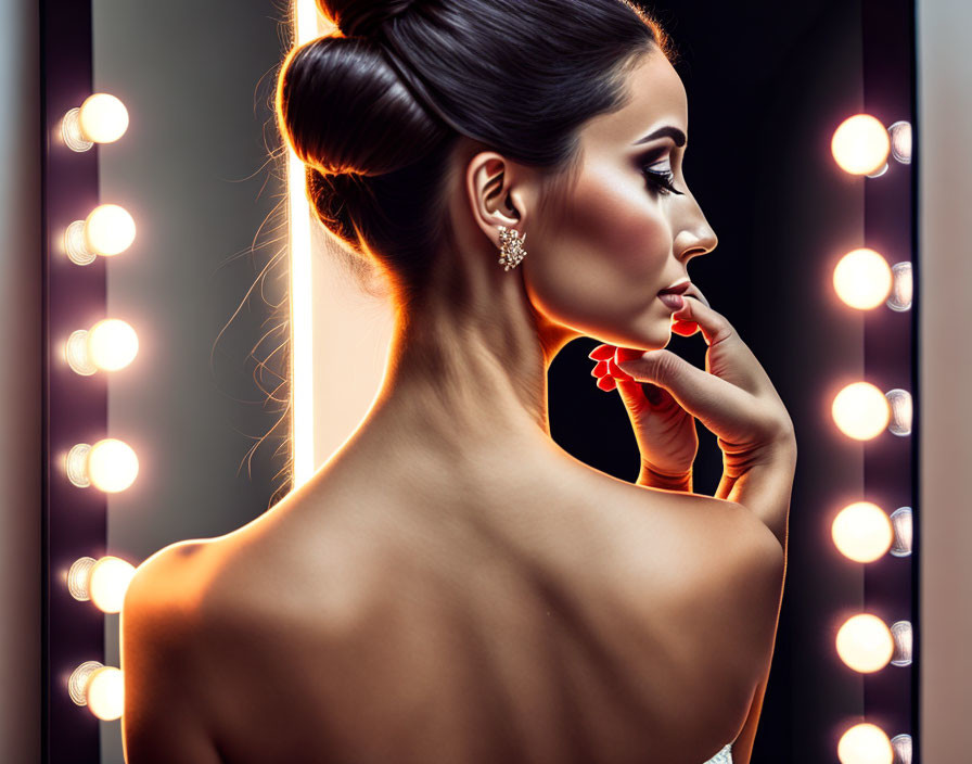 Profile of Woman with Elegant Updo and Makeup in Mirror's Glow