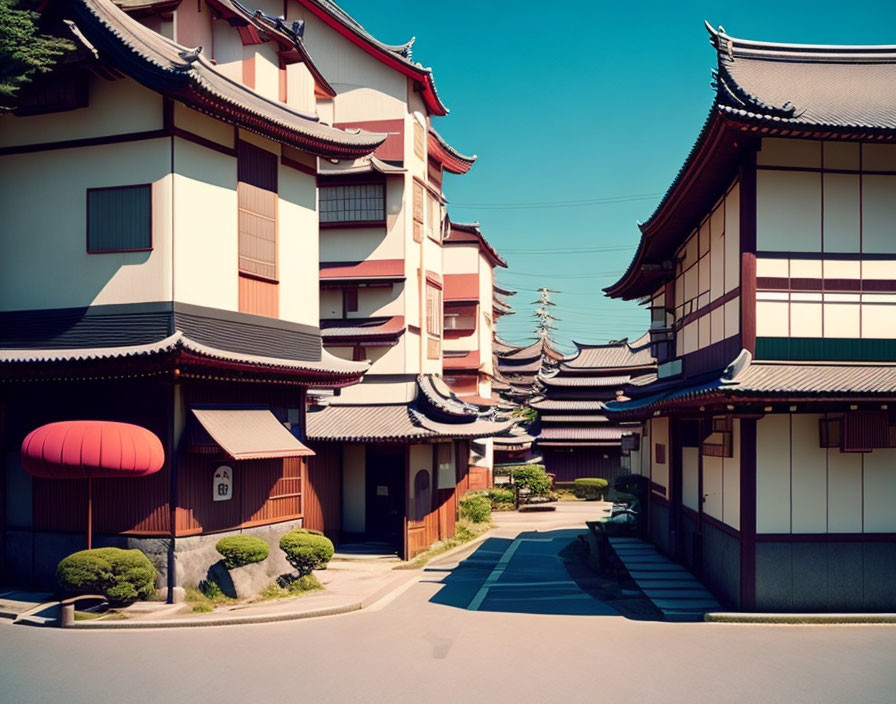 Japanese architecture: Curved rooflines and pagoda under blue sky