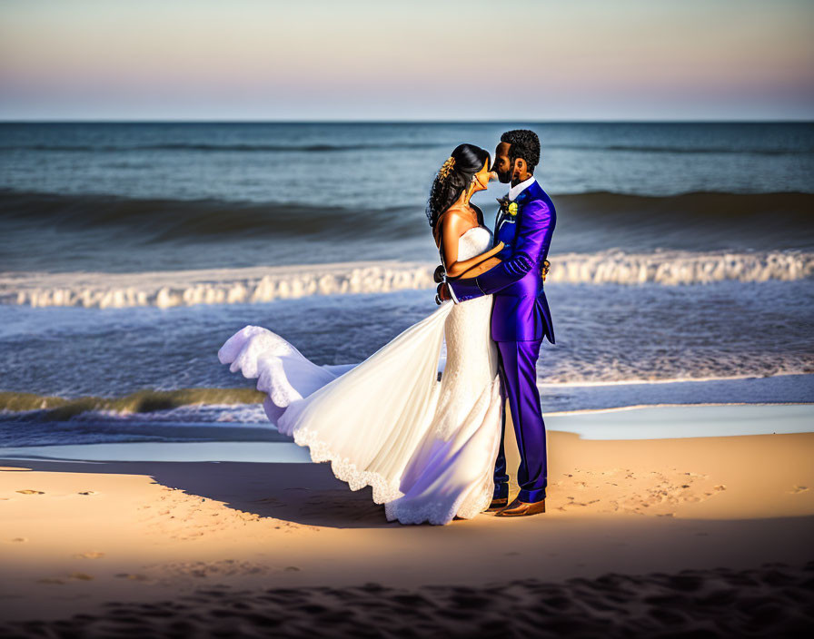 Newlywed couple embraces on sunlit beach