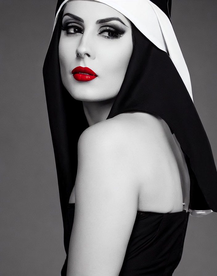 Monochromatic portrait of woman with red lips and dramatic eye makeup