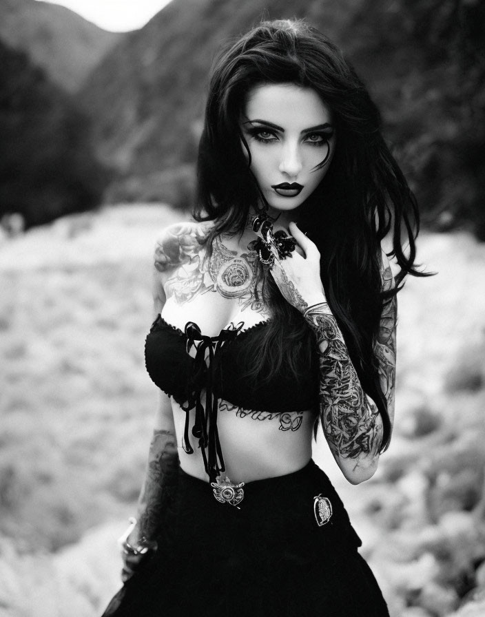 Tattooed woman with dark lipstick in black and white portrait