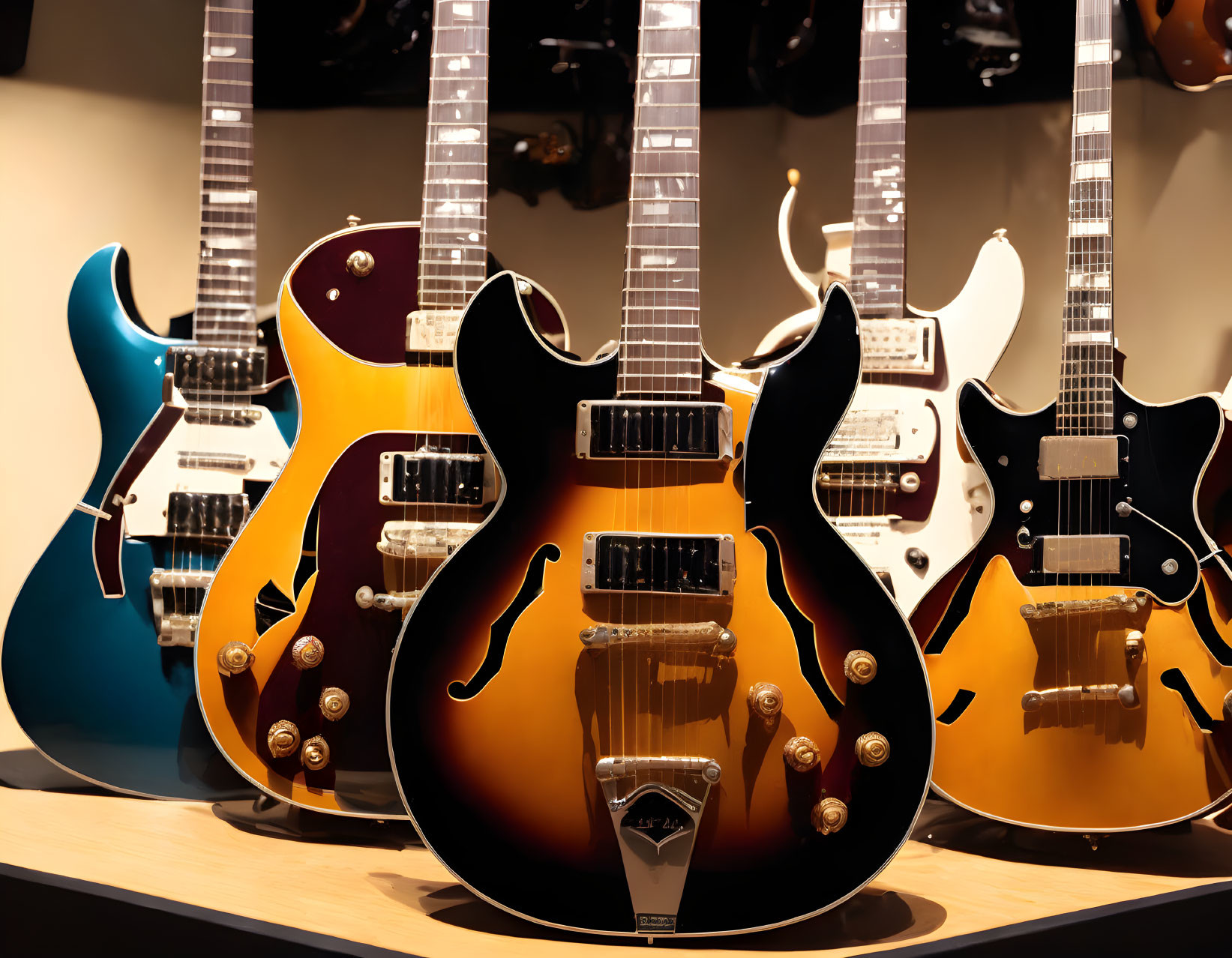 Assorted electric guitars display, featuring sunburst guitar and colorful variations