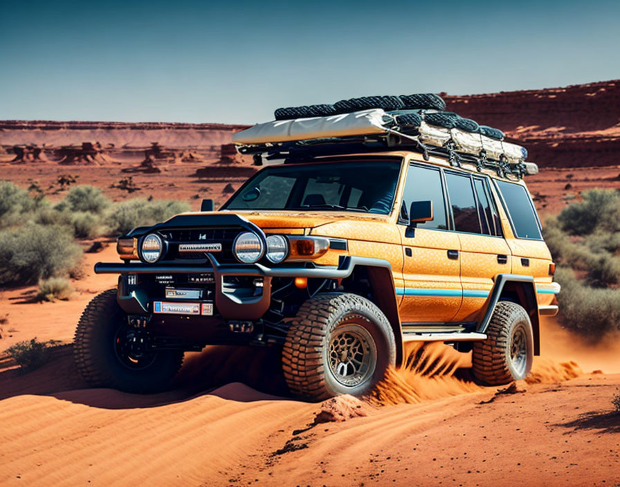 Orange SUV with roof rack navigating desert terrain under clear blue skies.