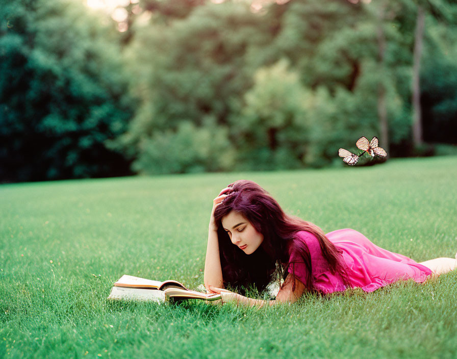 Woman in Pink Dress Reading Book in Grassy Field with Butterflies