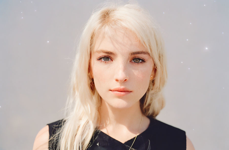 Blonde woman portrait with freckles and captivating eyes