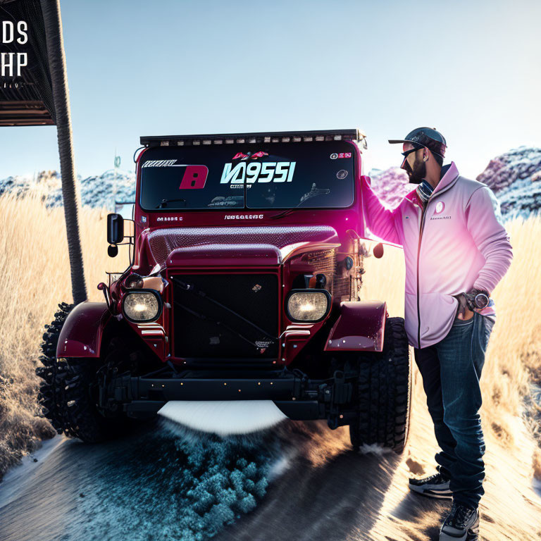 Man in hat and jacket next to vintage red Jeep on snowy hills