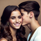 Young couple sharing a tender kiss on the cheek, both smiling, against brown backdrop