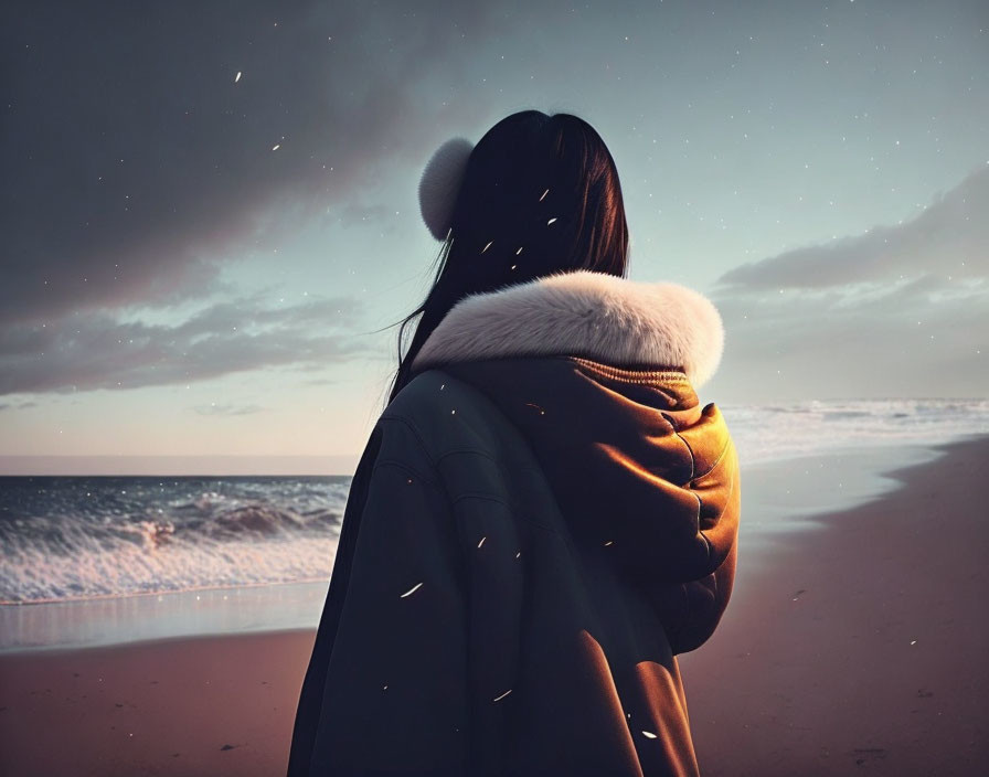 Person in warm jacket gazes at starry sky on beach at dusk