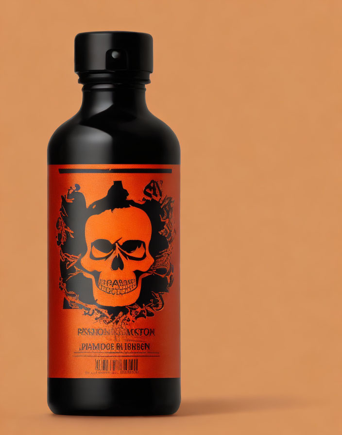 Black Skull Design Bottle with Intricate Orange Label on Orange Background